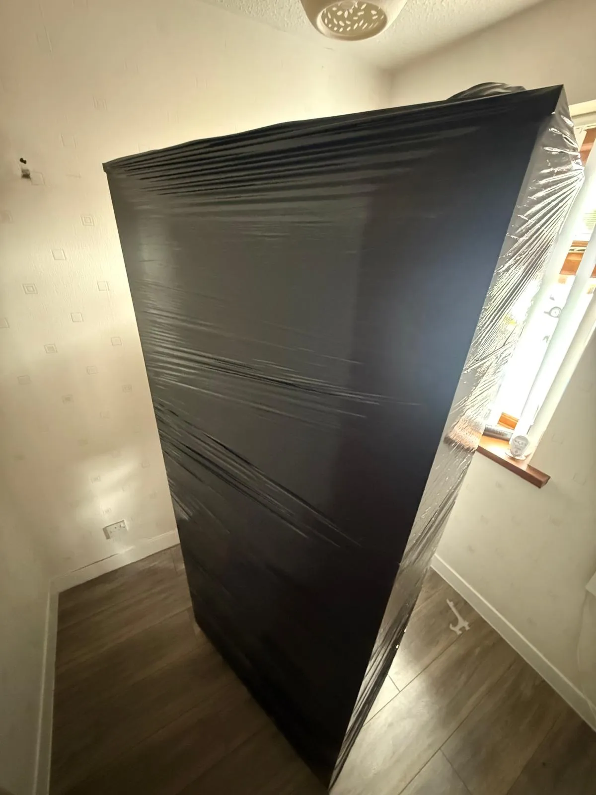 Furniture wrapped in black film
