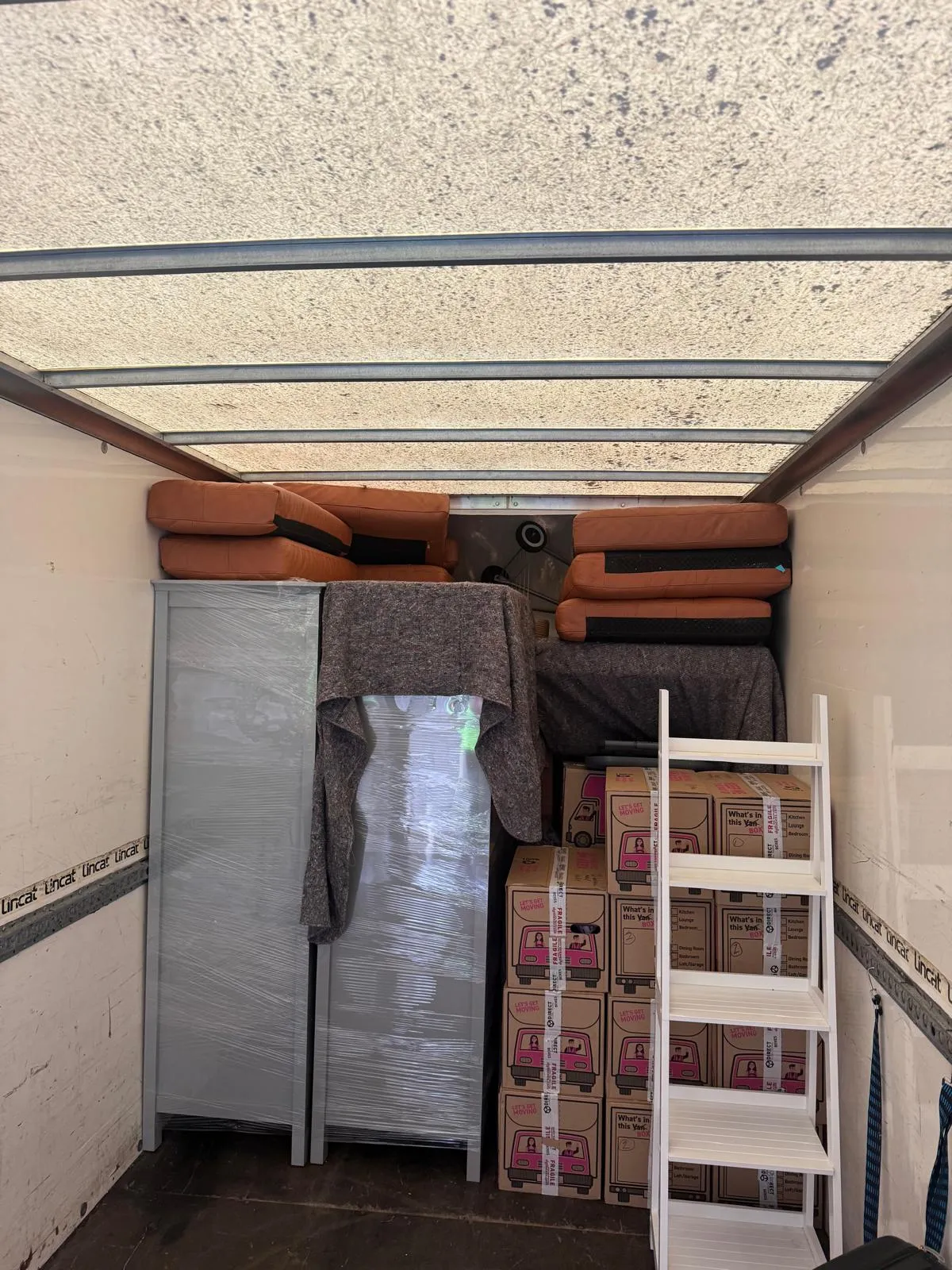 Furniture and boxes inside a van