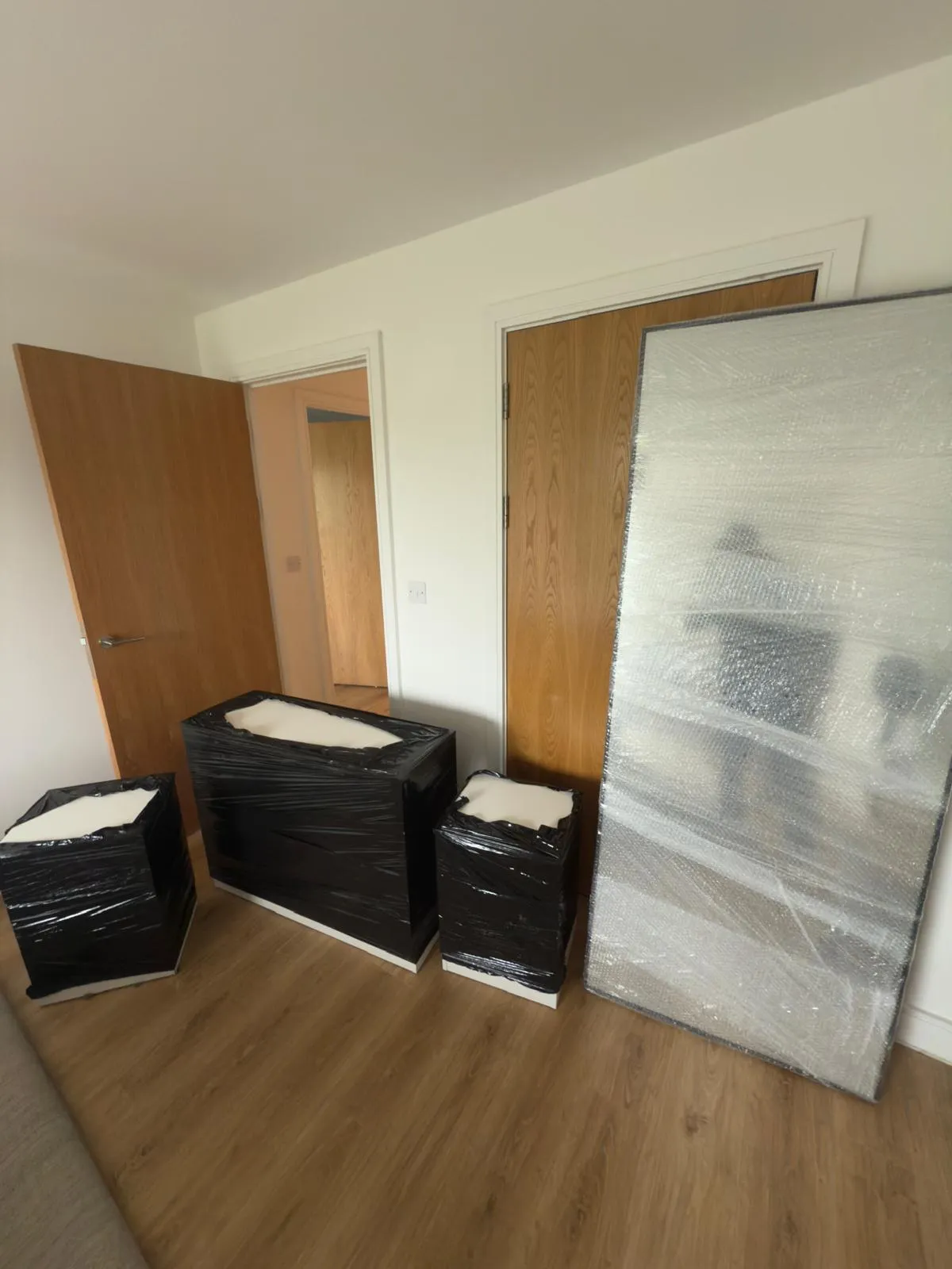 Wrapped furniture in a hallway